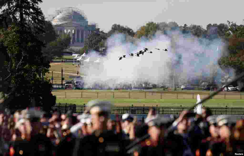 Geese take flight in front of the Jefferson Memorial as guns are fired in a salute during an official arrival ceremony for Australia&#39;s Prime Minister Scott Morrison by U.S. President Donald Trump on the South Lawn of the White House.