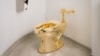 Gold Toilet Revealed at NYC Museum