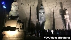 FILE: A huge granite statue of Ramses II (center) after the completion of restoration work, south of Cairo, Egypt, taken April 18, 2017.