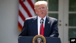 President Donald Trump speaks about the U.S. role in the Paris climate change accord, Thursday, June 1, 2017, in the Rose Garden of the White House in Washington. 