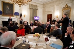 Gov. Jay Inslee, D-Wash., right, speaks about school safety during an event with President Donald Trump and members of the National Governors Association in the State Dining Room of the White House, Feb. 26, 2018.