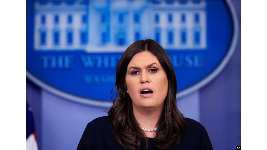 FILE - White House press secretary Sarah Huckabee Sanders talks to reporters during a press briefing in the Brady press briefing room at the White House, in Washington, Jan. 11, 2018.