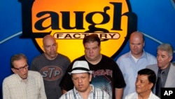 FILE - A group of comedians are seen at the Hollywood Laugh Factory.