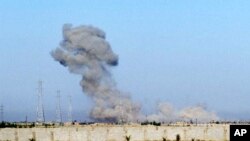 Smoke billows through the air during an offensive by Iraqi military forces into Fallujah to retake the city from Islamic State militants in Iraq, in an image taken from video, May 30, 2016.