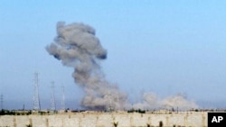 Smoke billows through the air during an offensive by Iraqi military forces into Fallujah to retake the city from Islamic State militants in Iraq, in an image taken from video, May 30, 2016. 