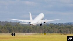In this photo provided by the Australian Defense Force, a Royal Australian Air Force P-8 Poseidon aircraft departs an airbase in Amberly, Australia, Jan. 17, 2022, to assist Tonga after the eruption of an undersea volcano. (LACW Emma Schwenke/ADF via AP)
