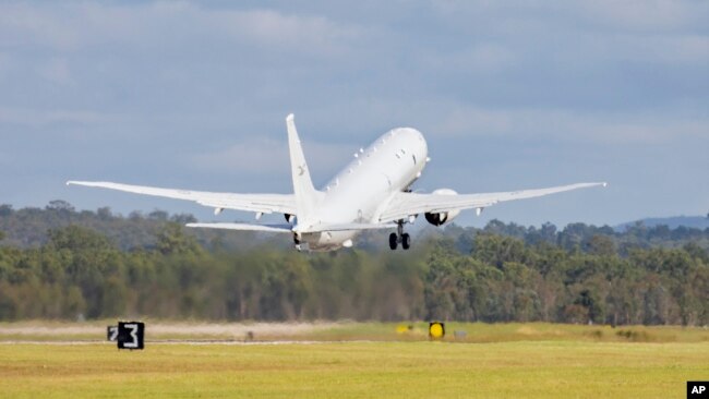 In this photo provided by the Australian Defense Force, a Royal Australian Air Force P-8 Poseidon aircraft departs an airbase in Amberly, Australia, Jan. 17, 2022, to assist Tonga after the eruption of an undersea volcano. (LACW Emma Schwenke/ADF via AP)