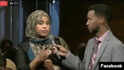 A moderator, right, and participant in the VOA Somali service's "Mogadishu-Minnesota" town hall meeting are seen in a screen grab from its Facebook stream.