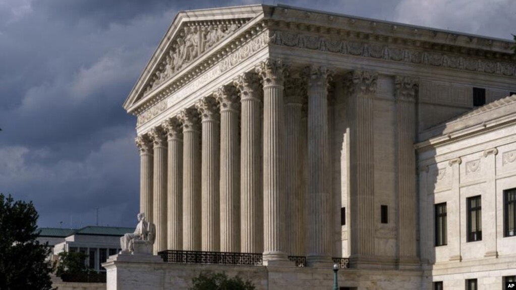 In this June 8, 2021 photo, the Supreme Court is seen in Washington. (AP Photo/J. Scott Applewhite)