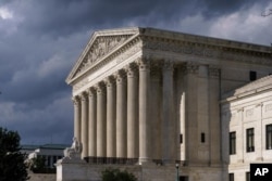 In this June 8, 2021 photo, the Supreme Court is seen in Washington. (AP Photo/J. Scott Applewhite)