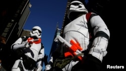 FILE - People dressed as Stormtroopers from Star Wars Rogue One walk in Times Square on Christmas Day in Manhattan, New York City, Dec. 25, 2016. 