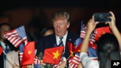 U.S. President Donald Trump arrives aboard Air Force One at Noi Bai International Airport in Hanoi, Vietnam November 11, 2017. 