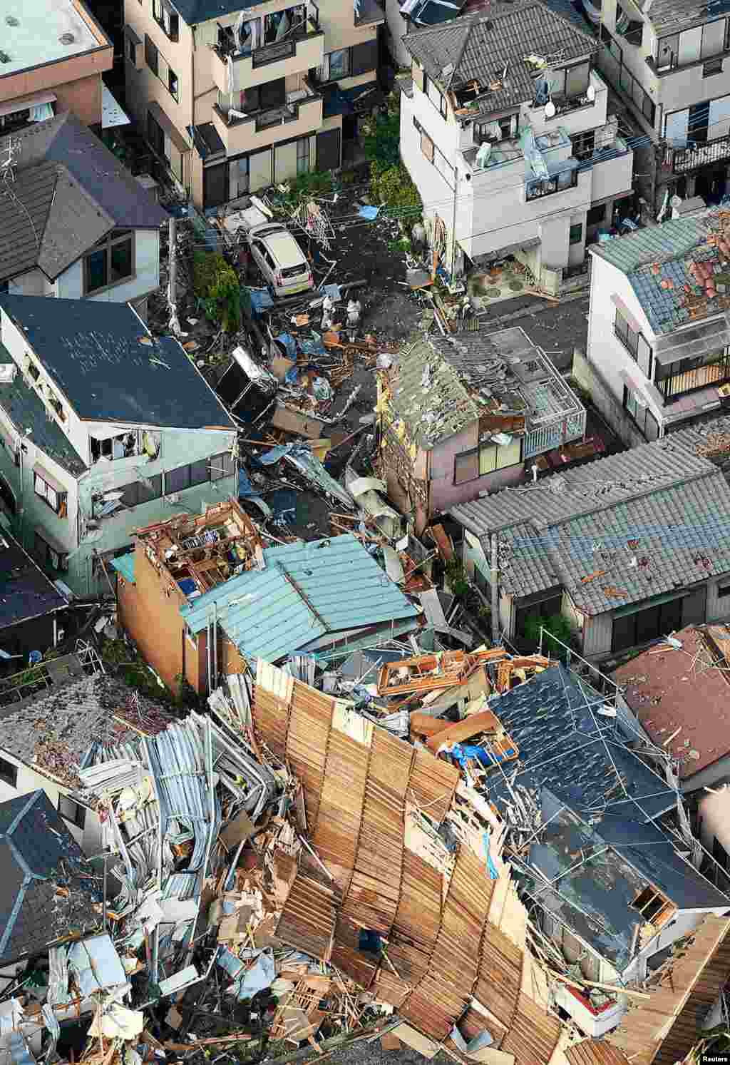 An aerial view shows damaged houses caused by what seemed to be a tornado in Koshigaya, north of Tokyo.
