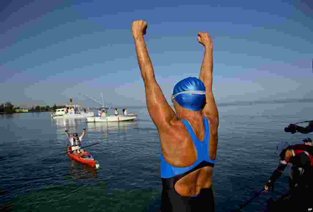 Swimmer Diana Nyad greets her support team before her swim to Florida from Havana, Cuba, Aug. 31, 2013. 