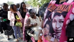 Detroit residents wait in line to enter the Greater Grace Temple for legendary singer Aretha Franklin's funeral in Detroit, Aug. 31, 2018.