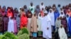 FILE - Nigeria's President Muhammadu Buhari meets with some of the newly released Dapchi schoolgirls in Abuja, Nigeria, March 23, 2018.