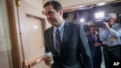 House Intelligence Committee Chairman Rep. Devin Nunes, R-Calif. is pursued by reporters as he arrives for a weekly meeting of the Republican Conference with House Speaker Paul Ryan and the GOP leadership, March 28, 2017, on Capitol Hill in Washington. 