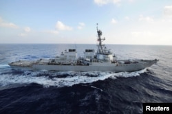 File - The guided-missile destroyer USS Mahan transits the Mediterranean Sea in this Aug. 31, 2012, handout photo.