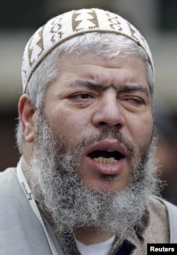 Muslim cleric, Abu Hamza al-Masri, leads prayers at the North London Central Mosque in Finsbury Park in this February 7, 2003 photograph.