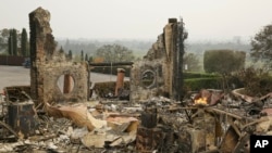 The remains of the Signorello Estate winery continue to smolder in Napa, Calif., Oct. 10, 2017.