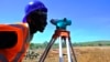 An engineer surveys the site of a power plant being built near Kenya's Lake Baringo. (Courtesy USAID) 