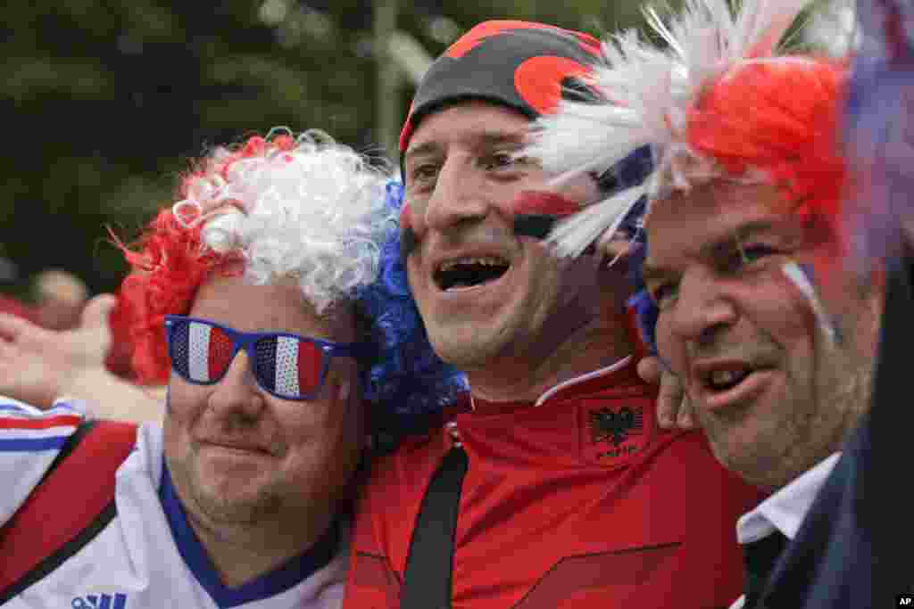 France&#39;s and Albania&#39;s soccer team supporters cheer together ahead of the Euro 2016 Group A soccer match between France and Albania at the Velodrome stadium in Marseille, France.