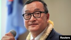 FILE - Cambodian opposition leader Sam Rainsy delivers a speech to members of the Cambodia National Rescue Party (CNRP) at a hotel in metro Manila, Philippines June 29, 2016.
