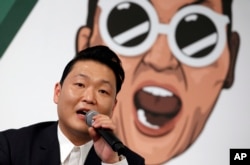 South Korean singer Psy answers a reporter's question during a news conference on the release of his seventh album in Seoul, South Korea, Nov. 30, 2015.