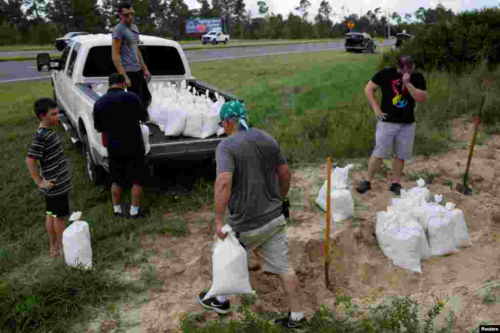 People prepare sand bags ahead of the arrival of Hurricane Dorian in Titusville, Florida, Aug. 31, 2019.