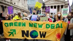Climate activists take part in protest through the streets of London, Nov. 6, 2021.