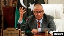 Libya's Prime Minister Ali Zeidan speaks during a joint news conference with Oil Minister Abdelbari al-Arusi at the Prime Minister's Office in Tripoli, July 2013.
