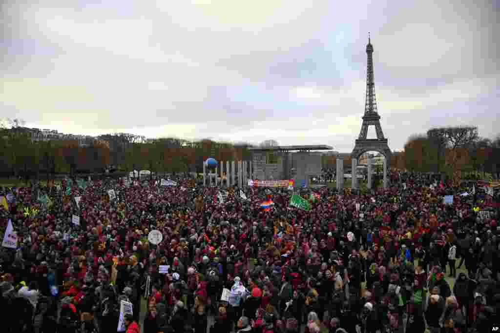 Activists gather near the Eiffel Tower in Paris.