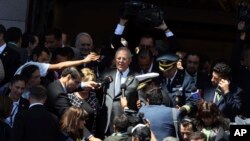Peru's President Pedro Pablo Kuczynski is surrounded by the press as he waits for his car after attending the inauguration of Chile's newly elected President Sebastian Pinera, in Valparaiso, Chile, March 11, 2018.