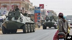 Armored personnel carriers of Cambodian Army drive through a road at Kampong Thom town, about 168 kilometers north of Phnom Penh, Cambodia - near border between Cambodia and Thailand, February 12, 2011.