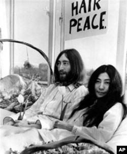 John Lennon and Yoko Ono held two week-long Bed-Ins for Peace in Amsterdam and Montreal to protest the US war in Vietnam. Here the couple is pictured at the Hilton Hotel in Amsterdam on March 25, 1969.