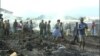 People assess the damage in part of a burned down market in Limbe, Cameroon, April 3, 2017. (M.E. Kindzeka/VOA)