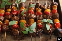 FILE - South African beef and apricot sosaties (kebabs) are seen in a photo illustration. Dishes with a variety of ethnic flairs served in communal food halls have become the latest craze in New York and other U.S. cities.