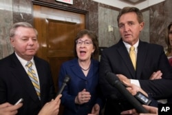 Sen. Lindsey Graham, R-S.C., from left, Sen. Susan Collins, R-Maine, and Sen. Jeff Flake, R-Ariz., speak to reporters after working with a bipartisan group of moderate senators to find a way to reopen the government, at the Capitol in Washington, Jan. 22, 2018.