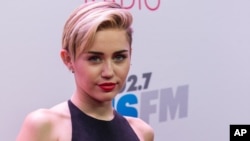 Miley Cyrus arrives at the KIIS 102.7 Jingle Ball held at the Staples Center in Los Angeles, California, Dec., 6, 2013. 