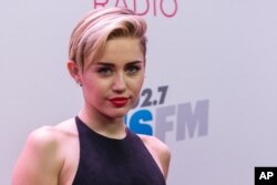 Miley Cyrus arrives at the KIIS 102.7 Jingle Ball held at the Staples Center in Los Angeles, California, Dec., 6, 2013.