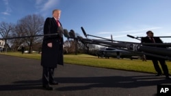 FILE - President Donald Trump speaks on the South Lawn of the White House with the presidential Marine One helicopter seen in the background, Jan. 6, 2019, in Washington.