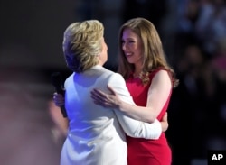 Chelsea Clinton, embraces her mother, Democratic presidential nominee Hillary Clinton, during the final day of the Democratic National Convention in Philadelphia , Thursday, July 28, 2016. (AP Photo/Mark J. Terrill)