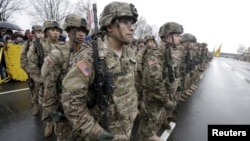 U.S. troops participate in Latvia's Independence Day military parade Nov. 18, 2015, in Riga, Latvia. With signs growing of a thaw between Moscow and Western capitals, some of Russia's neighbors fear a dip in European resolve over the Ukraine crisis.