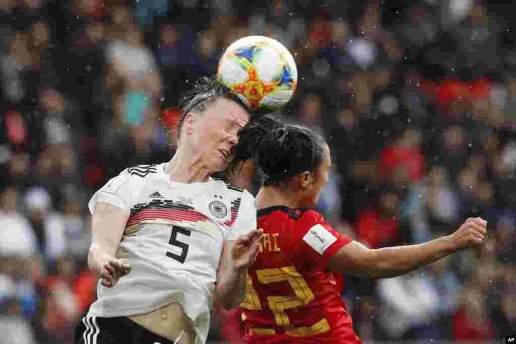 Germany&#39;s Marina Hegering, left, goes for a header with Spain&#39;s Nahikari Garcia during the Women&#39;s World Cup Group B soccer match between Spain and Germany at Stade du Hainau in Valenciennes, France.