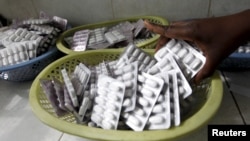 FILE - A pharmacist dispenses antiretroviral drugs at Mater Hospital in Kenya's capital Nairobi, Sept. 10, 2015. 