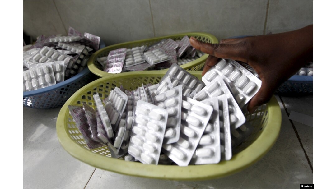 FILE - Ruth Munyao, a pharmacist, dispenses antiretroviral (ARV) drugs at the Mater Hospital in Kenya's capital Nairobi, Sept. 10, 2015.