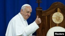 Pope Francis gestures to prisoners at Curran-Fromhold Correctional Facility in Philadelphia, Sept. 27, 2015. 