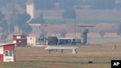 An unmanned aerial vehicle maneuvers on the runway after it landed at the Incirlik Air Base, on the outskirts of the city of Adana, southern Turkey, July 30, 2015. 