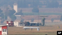 An unmanned aerial vehicle maneuvers on the runway after it landed at the Incirlik Air Base, on the outskirts of the city of Adana, southern Turkey, July 30, 2015. 