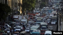 FILE - Cars are stuck in a traffic jam in downtown Cairo, September 2013.